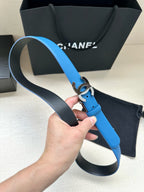 Blue leather belt with silver CC buckle and black keeper loop