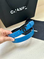 Blue leather belt with silver CC buckle and visible strap holes