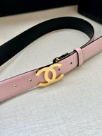 Chanel belt with pale pink strap and gold CC logo centered on the buckle