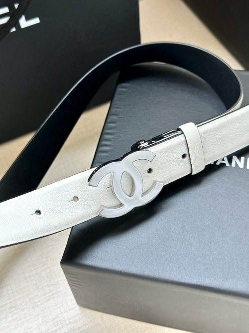 White leather Chanel belt with silver buckle and embossed logo detail