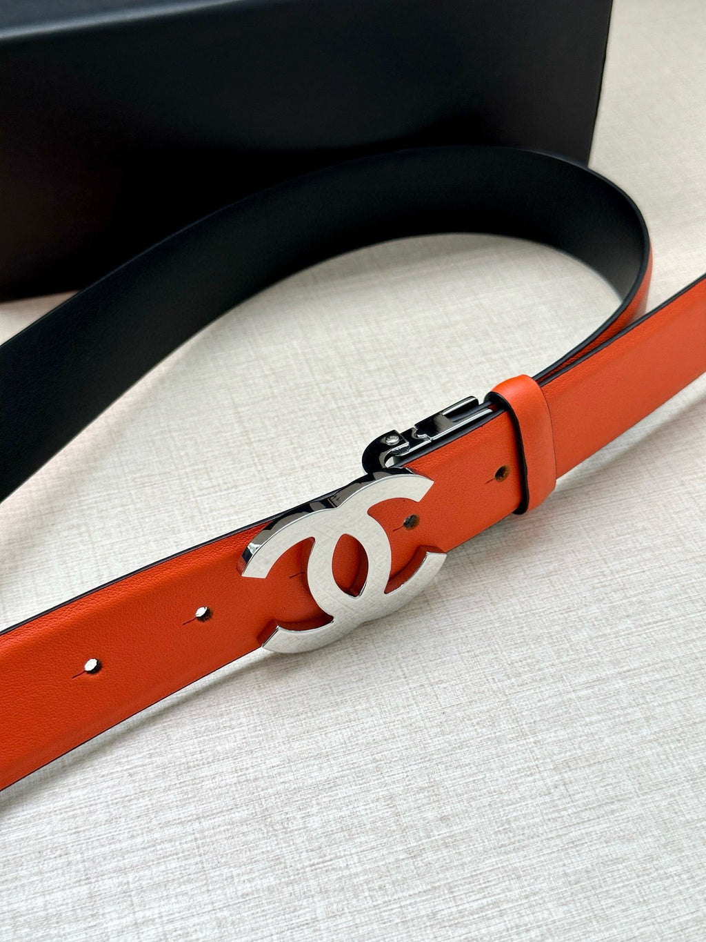 Chanel orange leather belt with large silver CC buckle and metal clasp