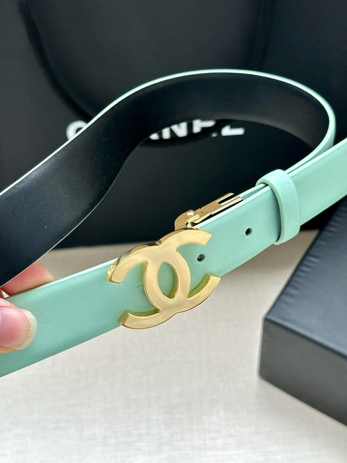 Chanel belt in light mint leather with gold CC buckle, angled close-up.