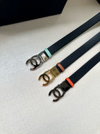 Chanel belt set with dark straps and CC buckles in silver, gold, and mint tones.