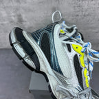 Balenciaga unisex sneaker quarter view, silver upper with black stripe, neon yellow laces