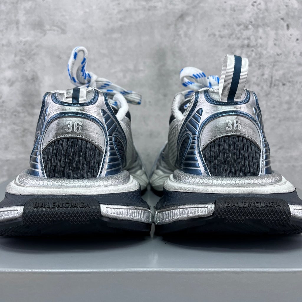 Balenciaga unisex sneakers heel view, silver uppers with black mesh and neon yellow accents