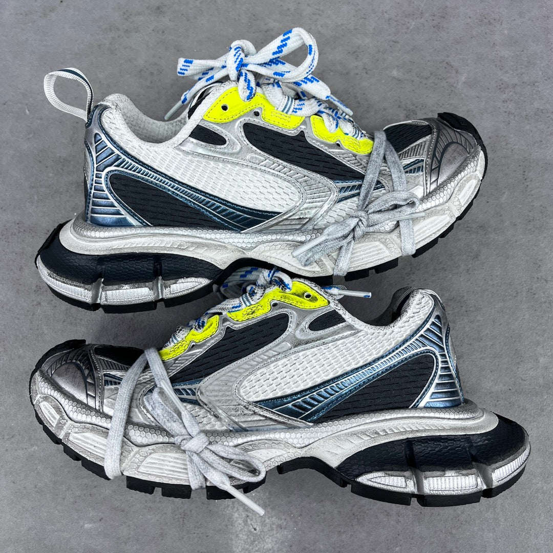 Balenciaga unisex sneakers with silver, black, and neon yellow accents, blue laces