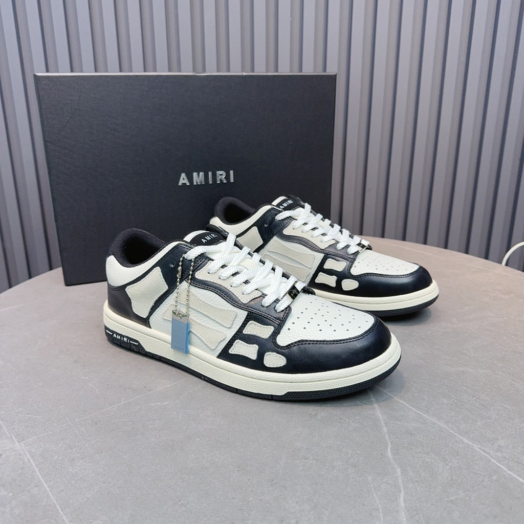 Leather sneakers in white with navy overlays, black laces, blue zipper detail, on box