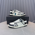 Leather low-top sneakers with white uppers, navy panels, black laces, blue zipper detail