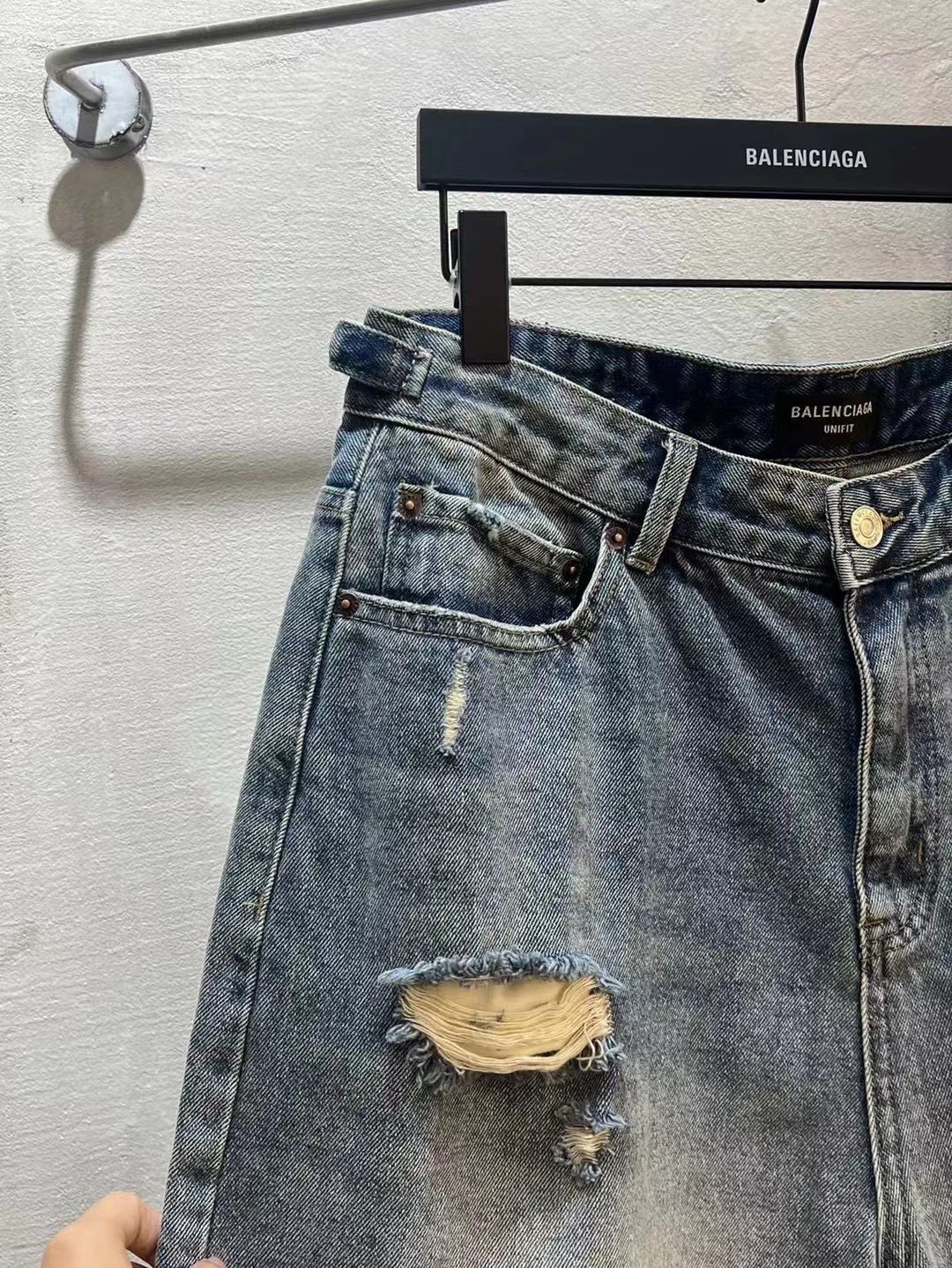 Balenciaga denim shorts waistband with belt loops and button closure, light blue