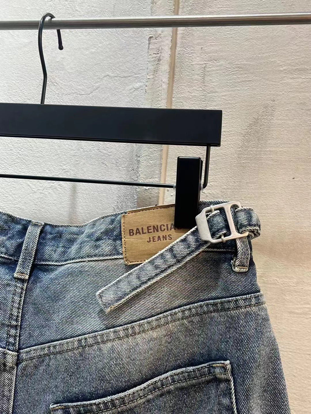 Balenciaga denim shorts with belt and buckle detail at the waist, light blue