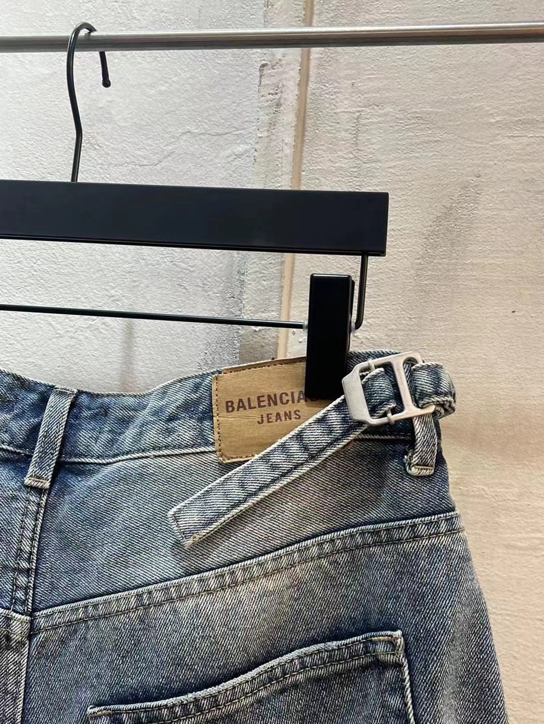 Balenciaga denim shorts with belt and buckle detail at the waist, light blue