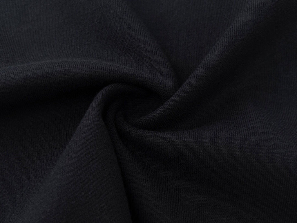 Stone Island dark fabric garment, draped cloth close-up