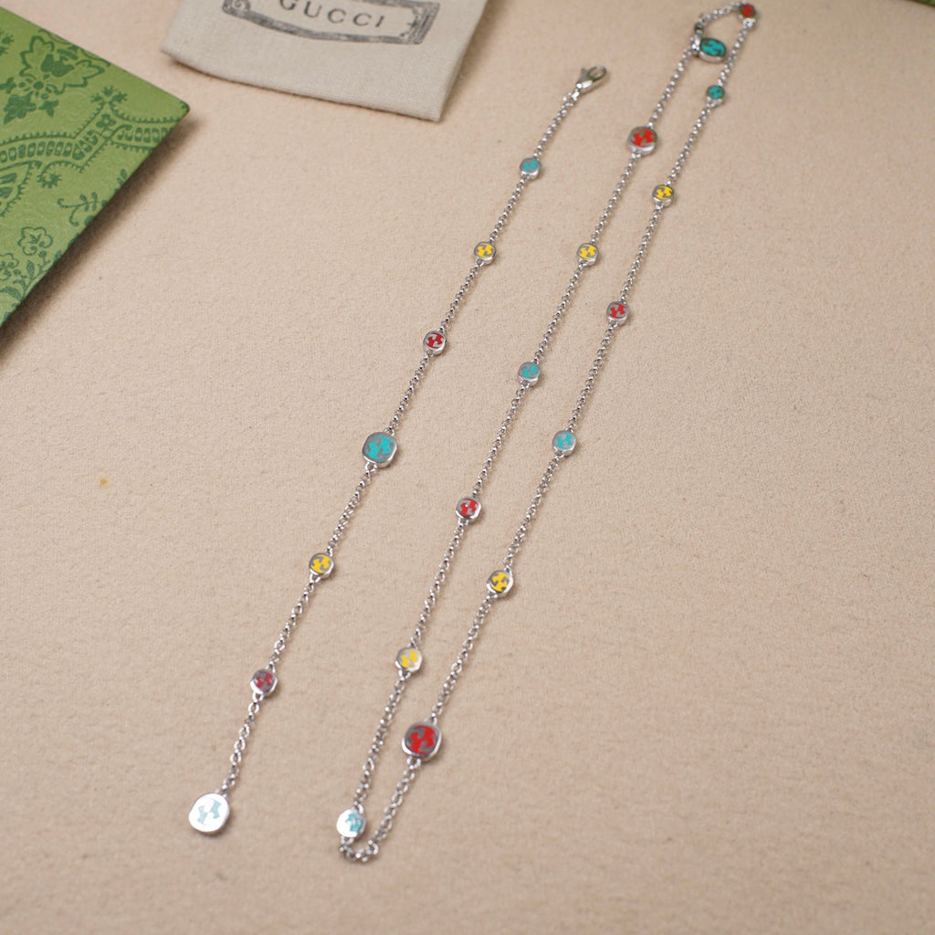 Gucci charm bracelet set with silver chain and multicolor enamel bead charms