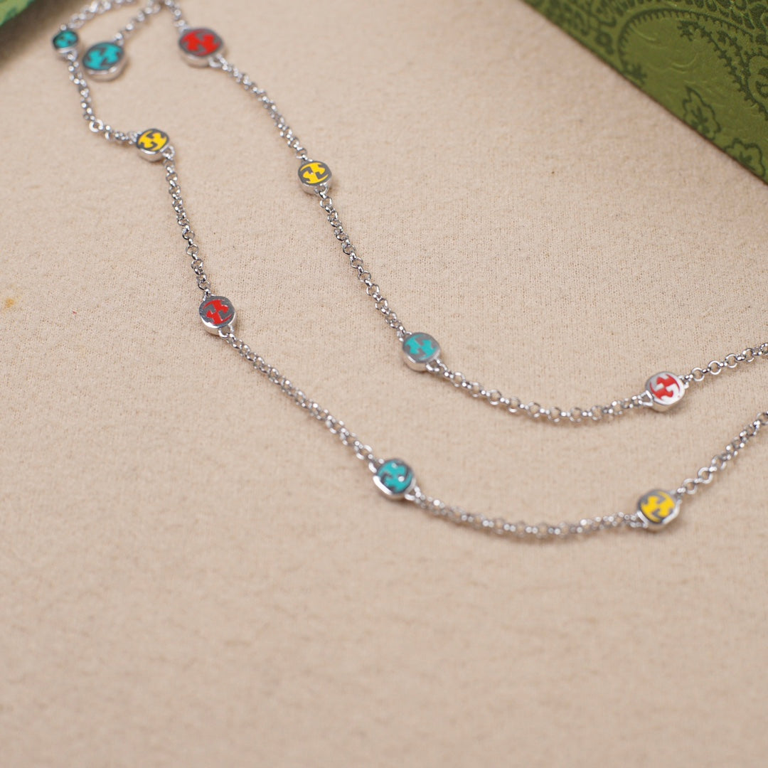 Gucci charm bracelet with silver chain and multicolor enamel bead charms