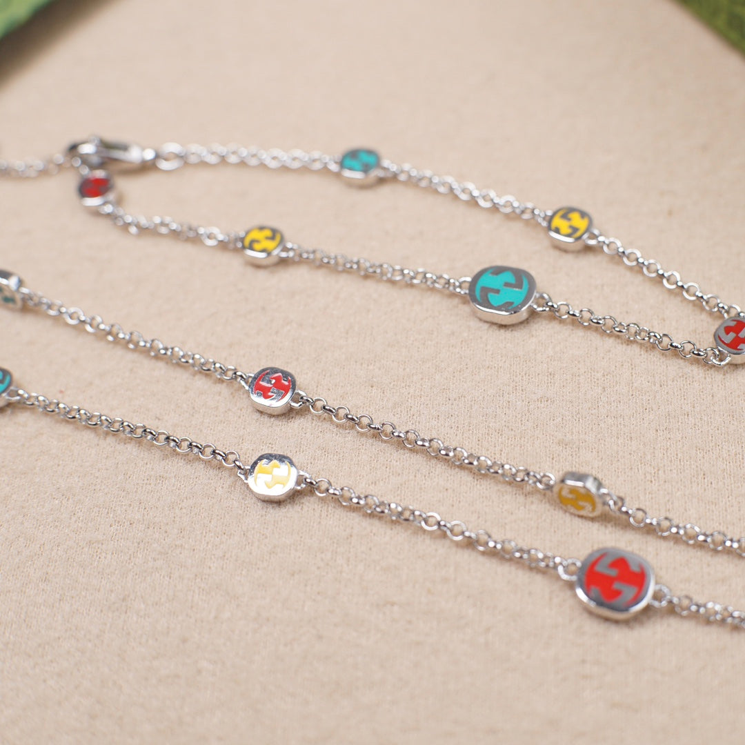 Gucci charm bracelets with silver chain and multicolor enamel bead charms