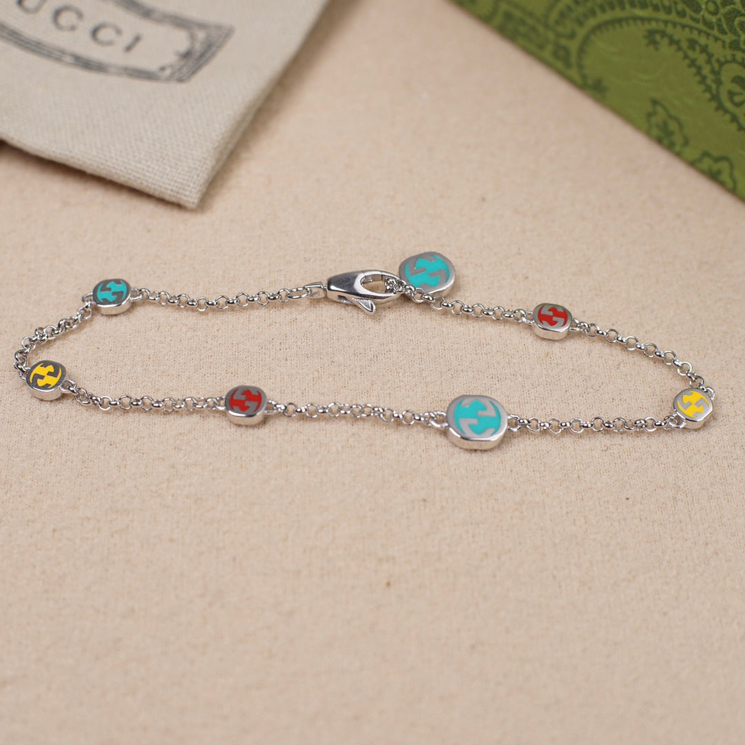 Gucci charm bracelet with silver chain and multicolor enamel bead charms