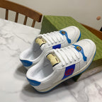 Pair of white and blue lace-up low-top sneakers with perforated panels and logo accents