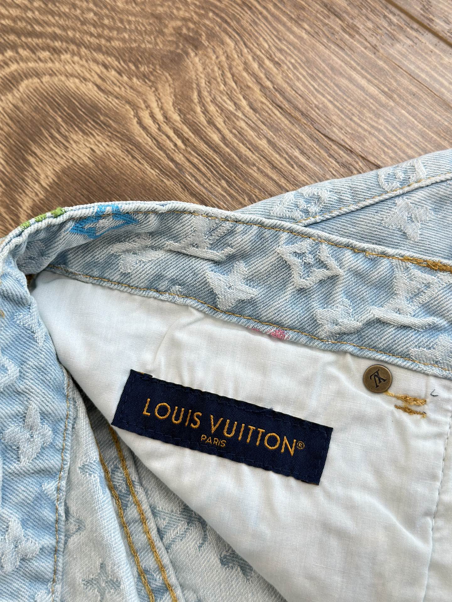 Light blue monogram denim shorts with dark blue Louis Vuitton Paris waistband label