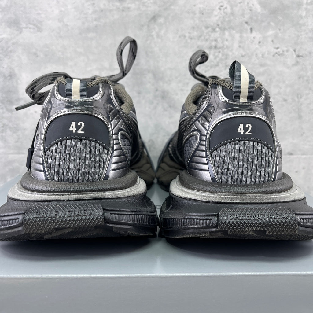 Back view sneakers with gray mesh uppers, black soles, and size marking '42'