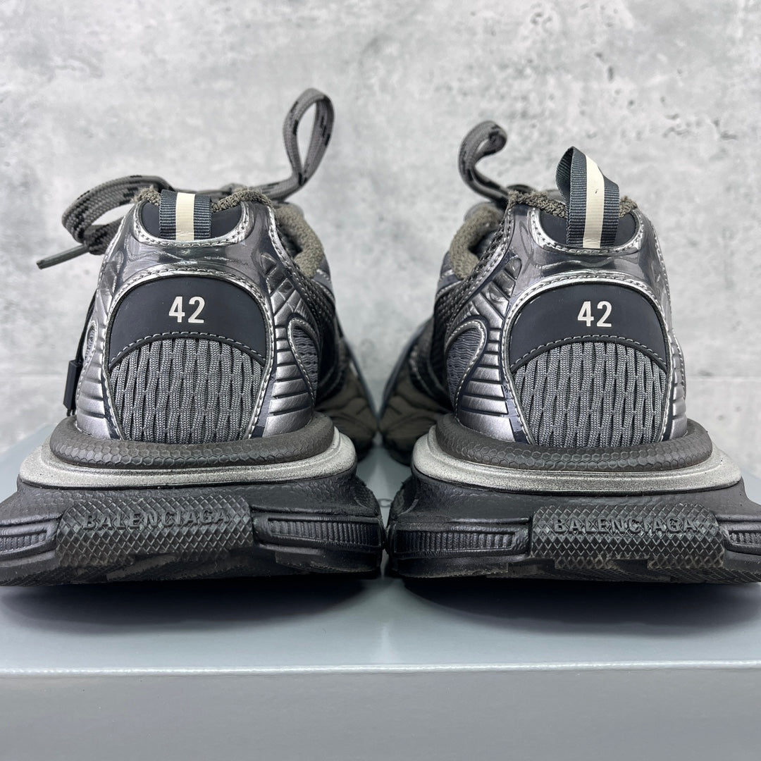 Back view sneakers with gray mesh uppers, black soles, and size marking '42'
