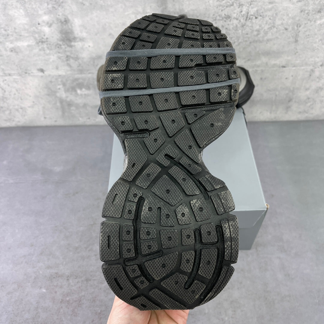 Shoe outsole view with a black tread pattern on a chunky rubber sole