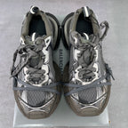 Pair of lace-up sneakers with gray mesh uppers and Balenciaga-branded heel panels
