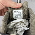 Shoe interior label with size '42' and care text on gray fabric lining