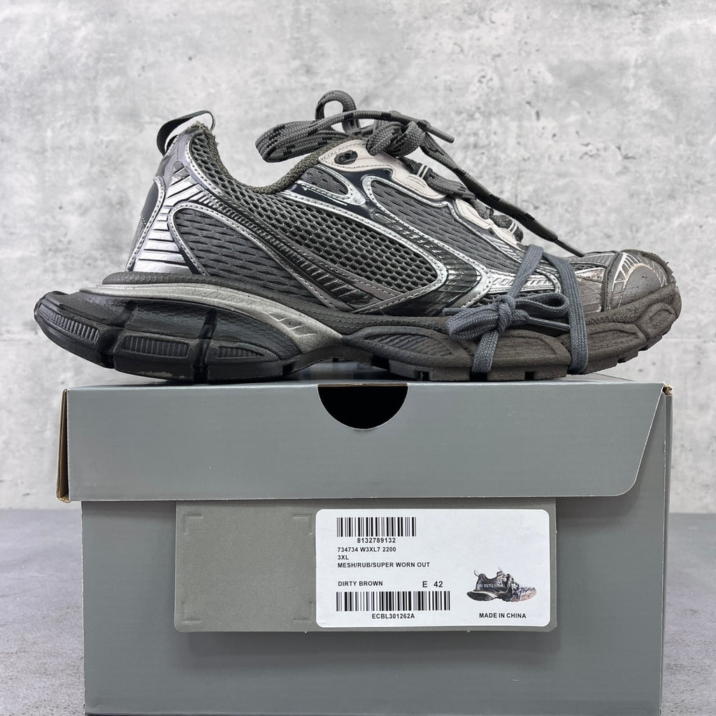 Lace-up chunky sneakers with gray mesh uppers and metallic silver panel detailing
