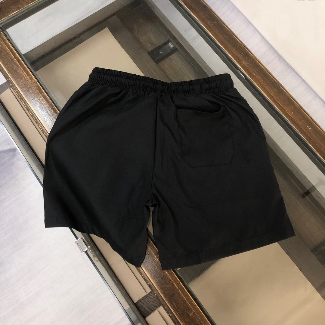 Black Versace shorts with elastic waistband and relaxed fit
