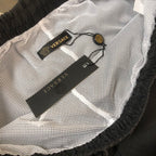 Black Versace shorts with mesh lining and inner waistband label