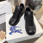 Black lace-up sneakers with thick sole and subtle side texture