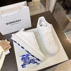 Pair of white low-top sneakers with textured side panel and blue logo graphic