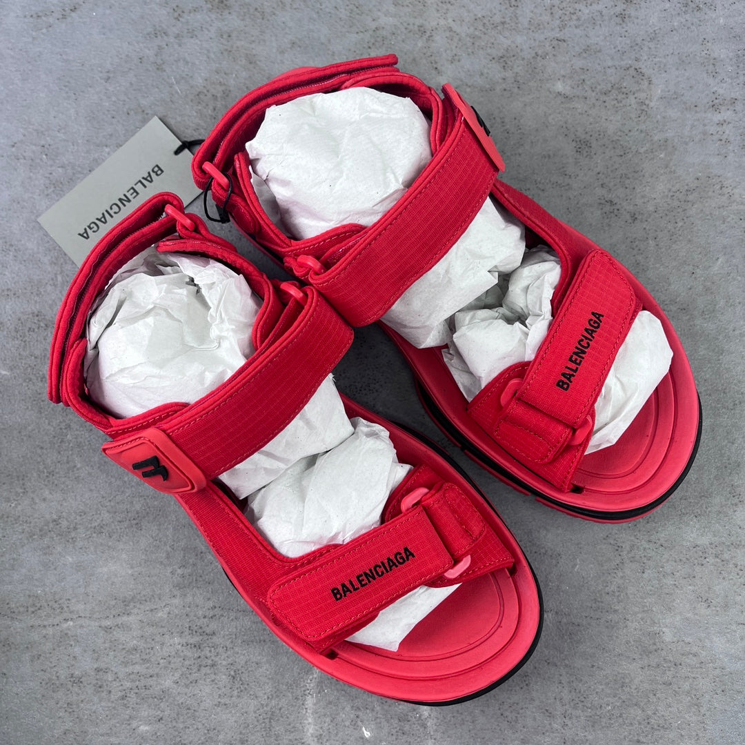 Red Balenciaga slides with two wide hook-loop straps and cushioned footbed
