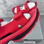 Red Balenciaga slip-on sandal with textured upper and padded hook-loop strap