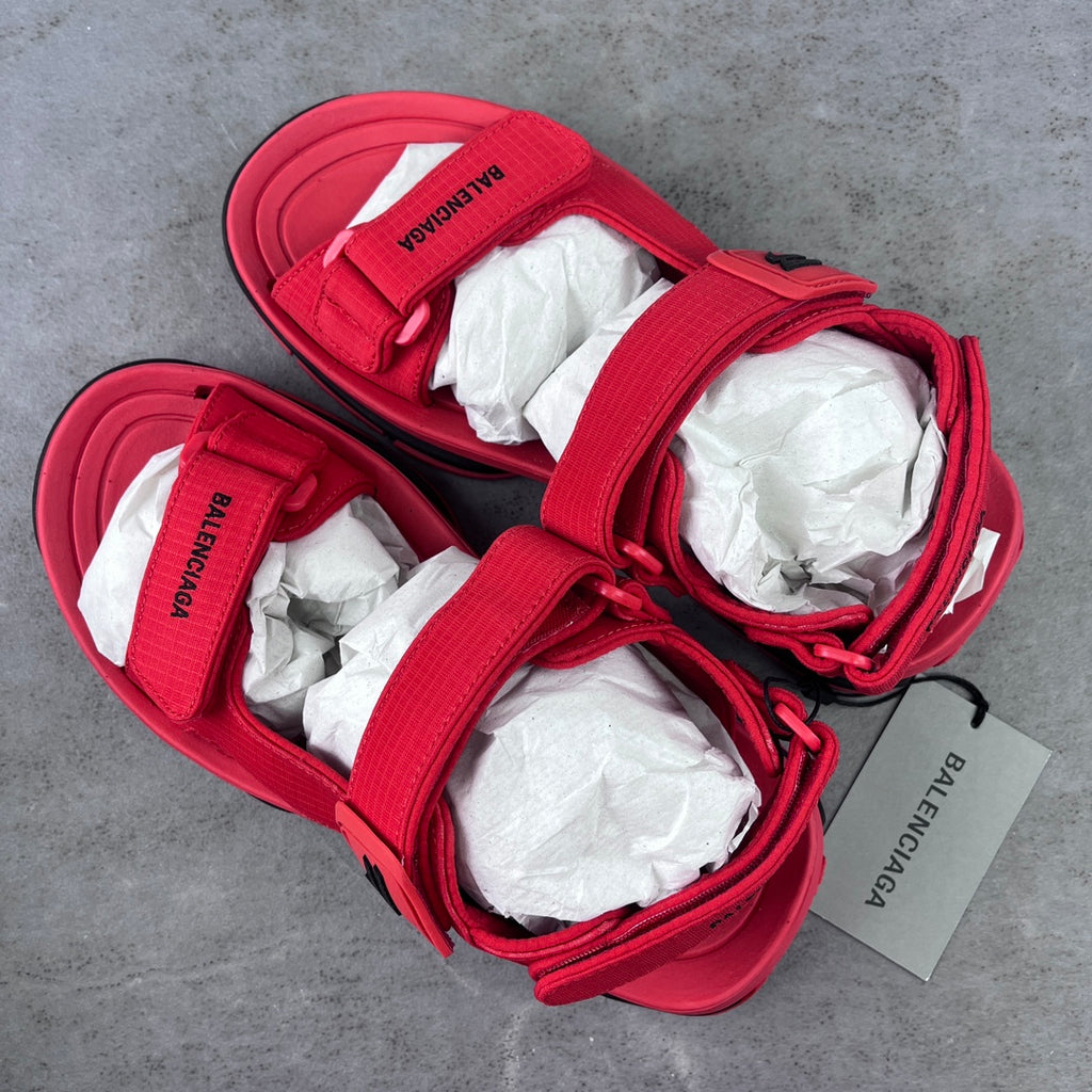 Red Balenciaga sandals with wide hook-loop straps and white tissue inserts