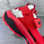 Red Balenciaga sandal with wide strap and black-trimmed rubber sole