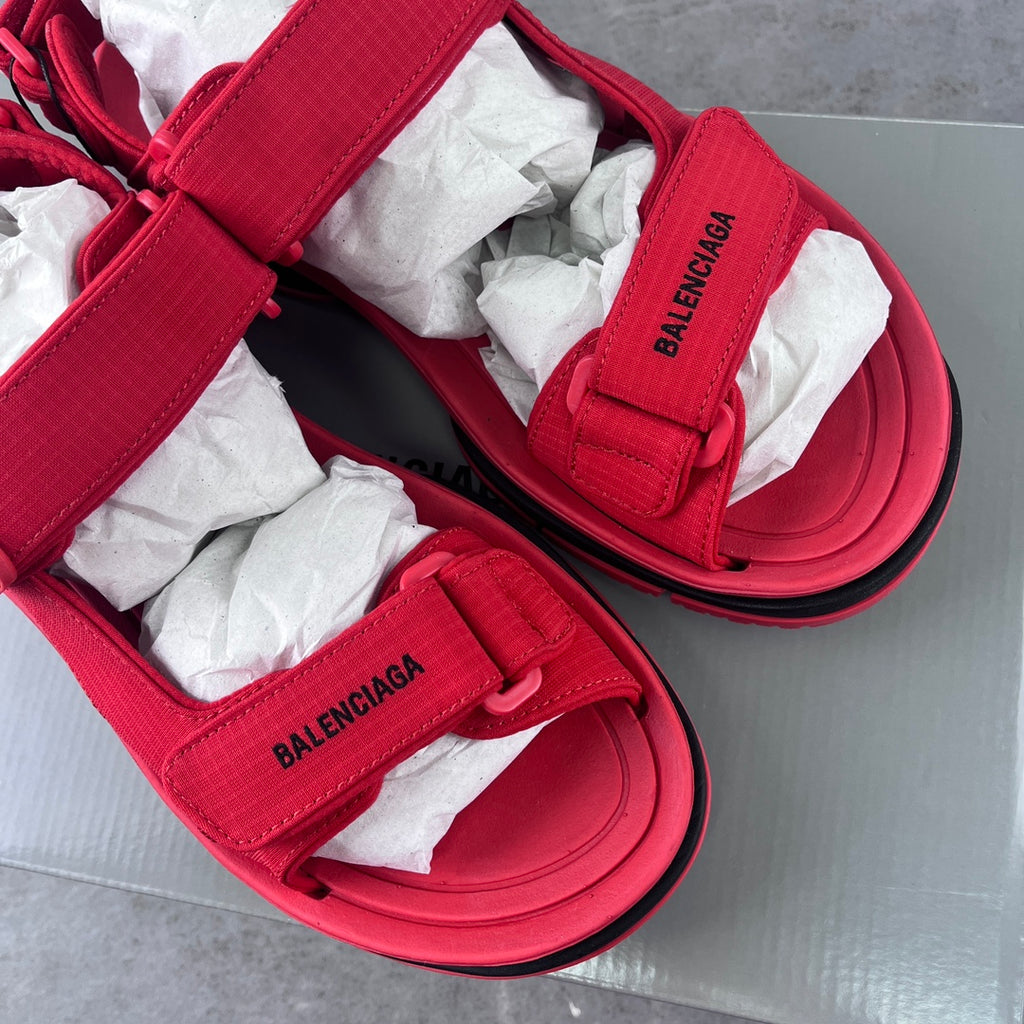 Red Balenciaga slide sandals with branded strap tabs and cushioned footbed