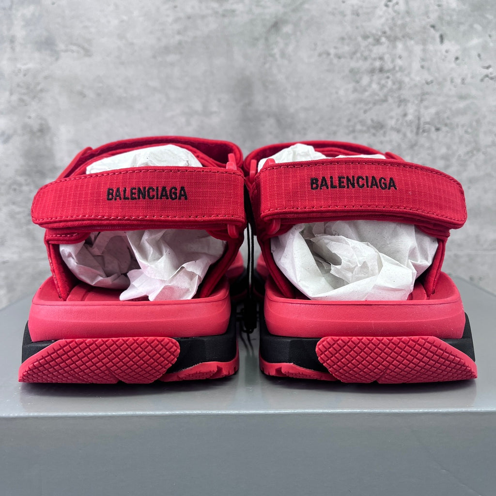 Red Balenciaga sandals with branded straps and textured rubber sole