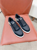 Navy lace-up sneakers with check-pattern panels and white rubber soles