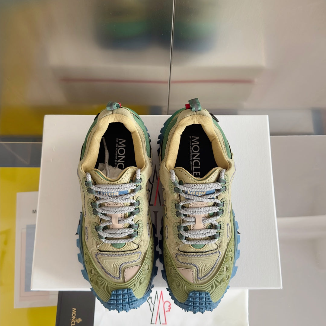 Moncler lace-up sneakers, olive uppers with green collars and blue tread sole, front view