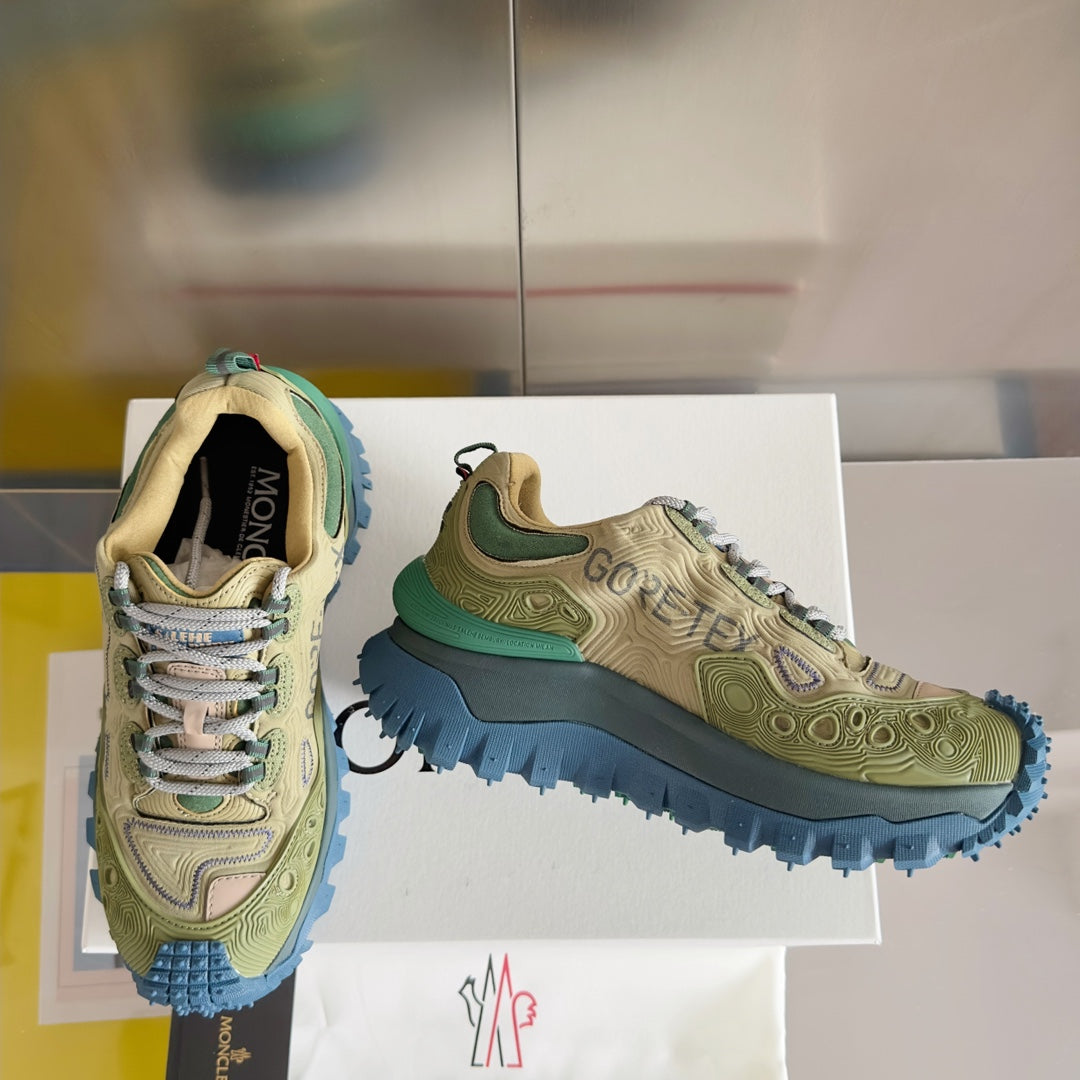 Moncler lace-up sneakers, olive mesh-and-suede style with blue outsole, pair on box