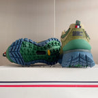 Moncler sneakers with green outsole tread and blue rubber sole, heel and side view