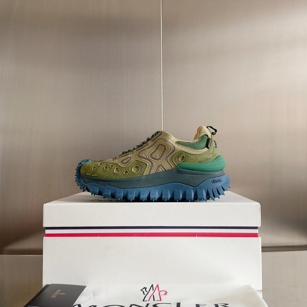 Moncler sneakers in olive and green with chunky blue outsole, single shoe on white box