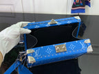 Louis Vuitton blue monogram bag open to reveal black interior compartment