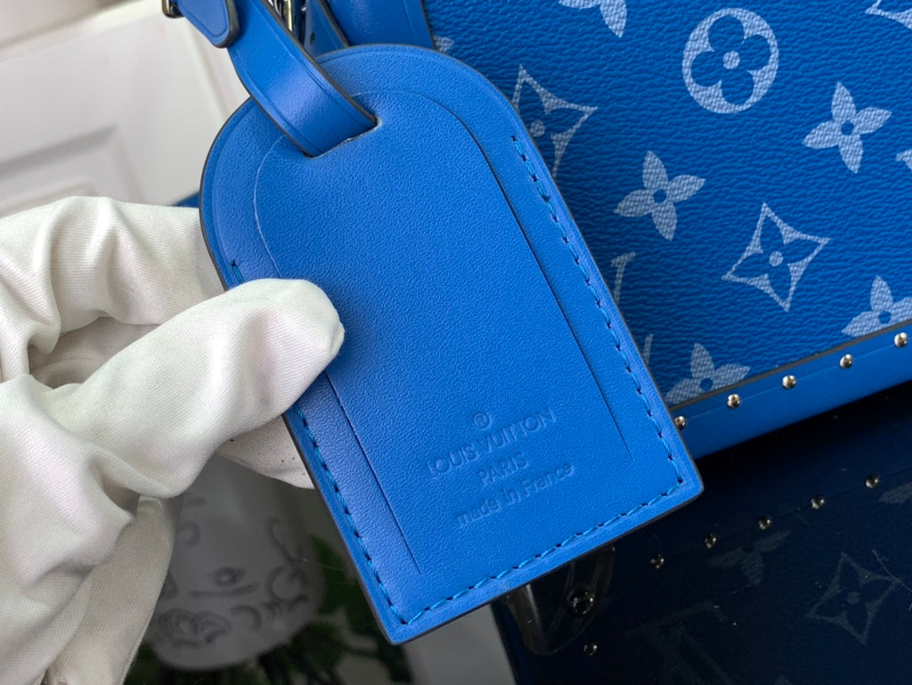 Louis Vuitton blue leather bag strap with stitched edge and embossed logo tag