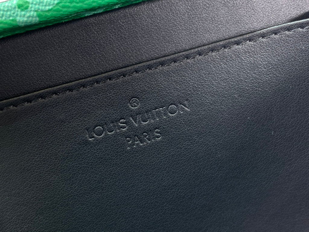 Black Louis Vuitton leather base with embossed logo and stitched edge