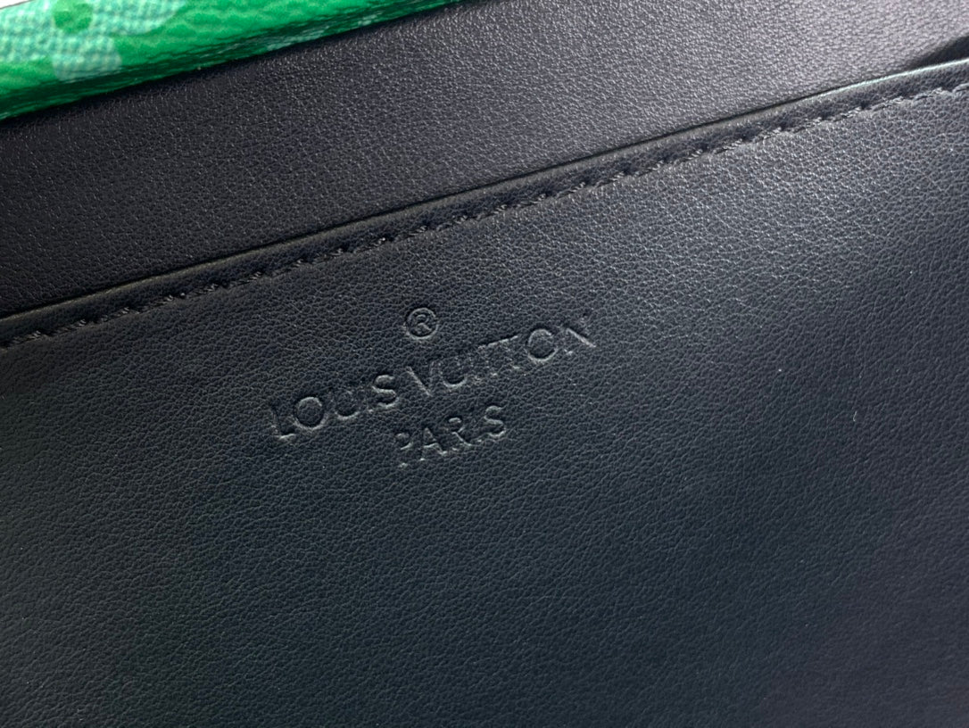 Black Louis Vuitton leather base with embossed logo and stitched edge