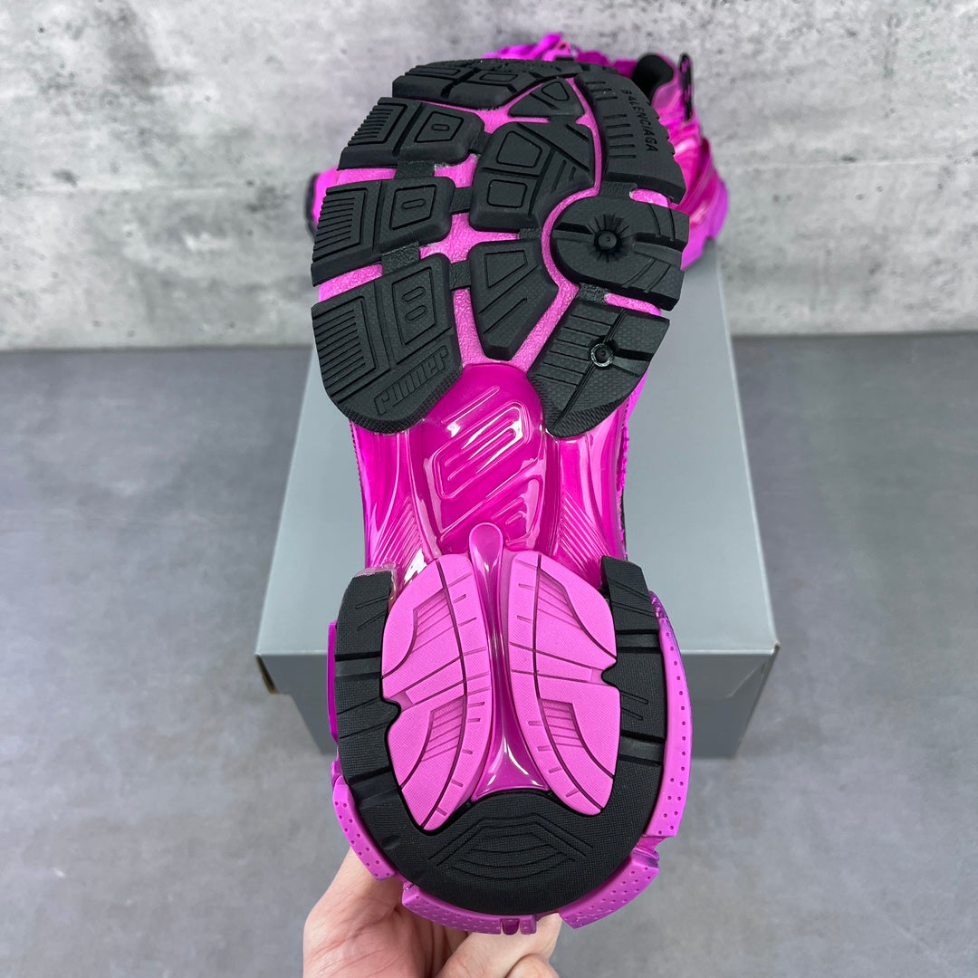 Balenciaga running sneakers outsole view in bright pink with black tread and traction