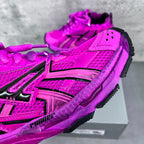 Balenciaga running sneakers close-up of bright pink mesh upper with black logo panels