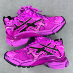Balenciaga running sneakers pair view, bright pink with black stripes and thick cushioning